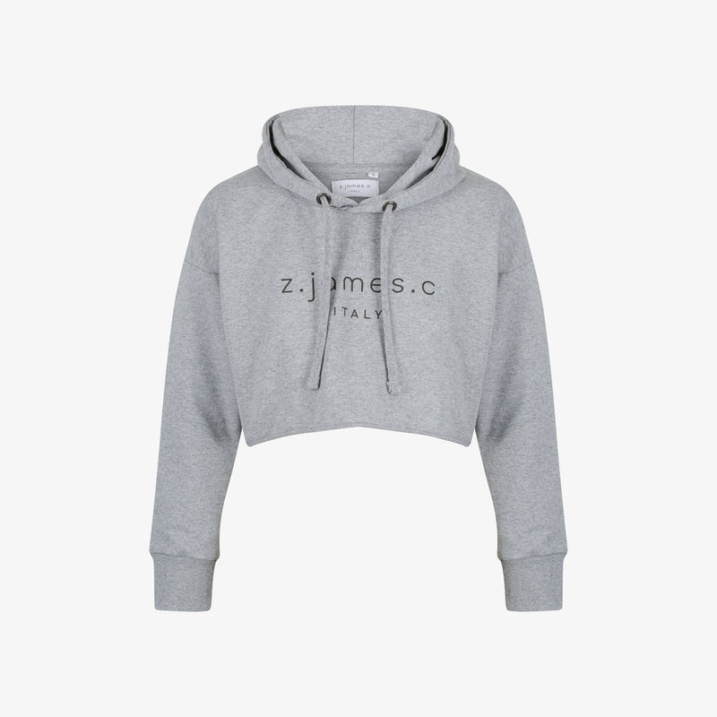 The grey crop hoodie for women by z.james.c. Featuring a logo print in black on the chest and cropped length.