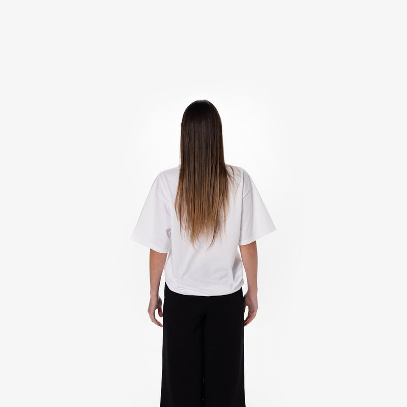 A female fashion model wearing the white Oversized T for the fashion brand z.james.c